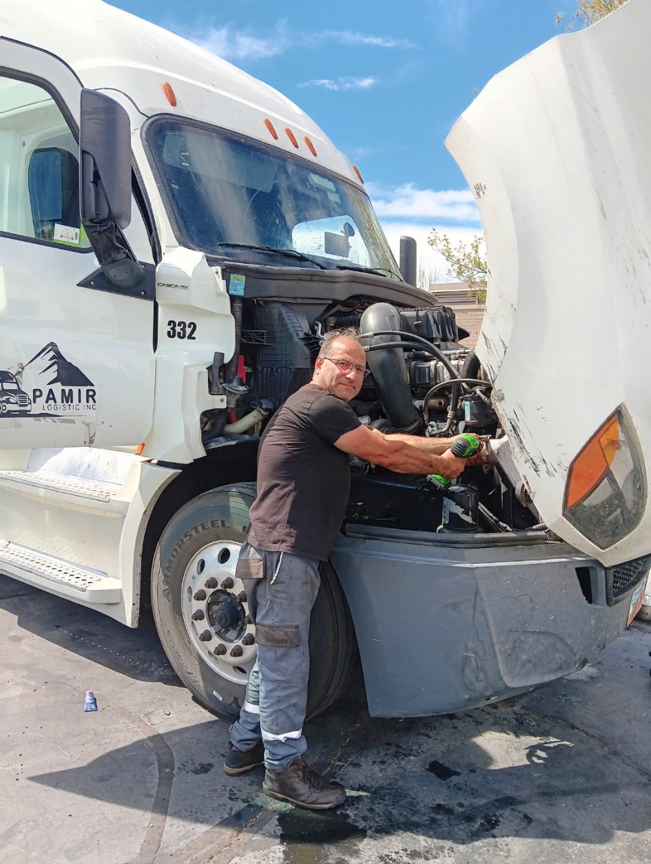 Habib Rad working on a semi truck engine